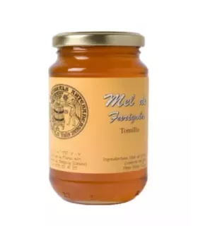 Miel monofloral de tomillo en frascos.